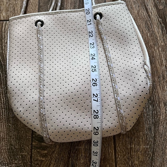 NWOT ah•dorned Neoprene perforated shoulder tan bag - Picture 13 of 16